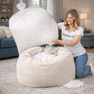 Poly Beads 10 cubic feet bean bag filler being poured from large clear bag into cream bean bag by woman wearing Foam4U t-shirt